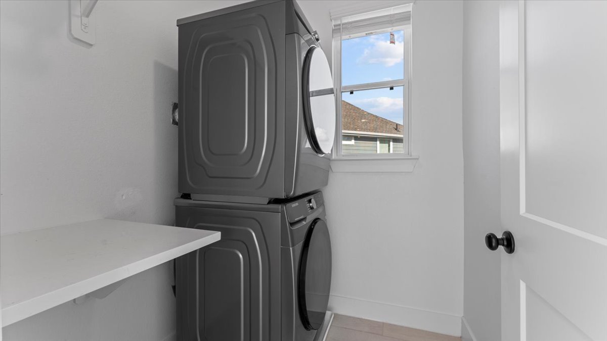 Laundry room – In-home washer and dryer for guests in midterm rentals for traveling professionals.
