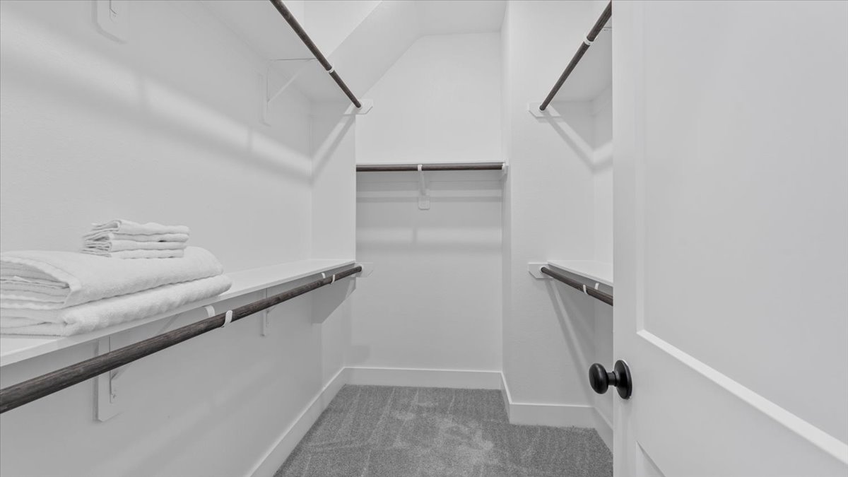 Walk-in closet with built-in shelving – Spacious walk-in closet in midterm rentals Cypress TX for traveling professionals, offering ample storage for extended stays.